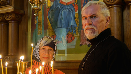 Elderly married couple in orthodox church