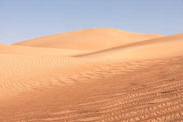 Fototapeta na wymiar Abstract view of sand dunes in the desert.