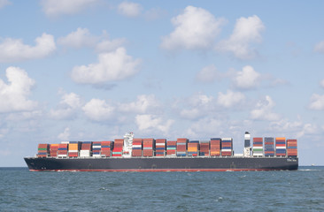 Container ship at open sea. © Riekelt