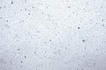 Myriads of snowflakes in a bluish haze during a snowfall