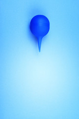 Blue enema on a colored background