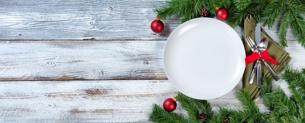 Christmas Table place setting on rustic white wood