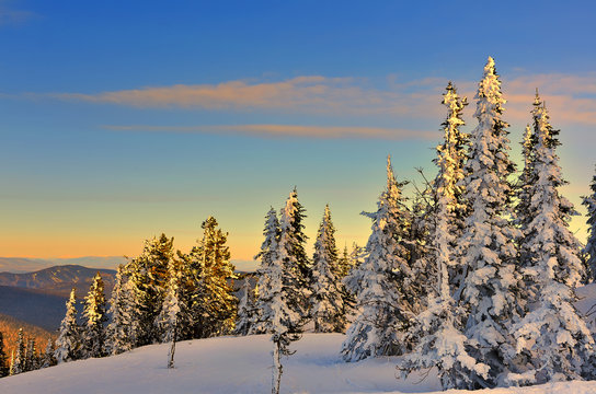 Winter mountain landscape at the gentle colors of setting sun