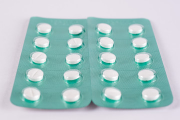 Different medicines. Tablets, pills in blister pack. Medications drugs. Pills over a white background. Medicament treatment. Health care photo.