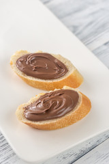 Slices of baguette with chocolate cream