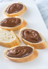 Slices of baguette with chocolate cream