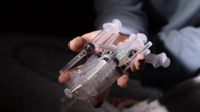 Syringe drug abuse concept