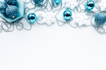  happy holidays and frame made of christmas decoration with blue christmas balls, tinsel. christmas wallpaper. flat lay, top view