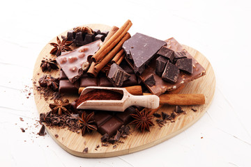 chocolate concept with assorted chocolate, powder and spice.