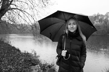 Blonde girl with umbrella in Kranichstein, Germany