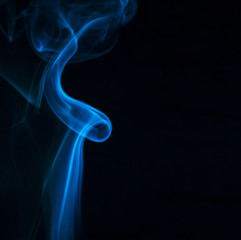 Blue smoke on black background