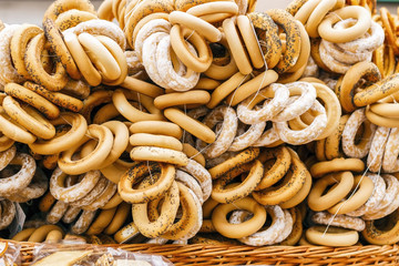 Sale of bagels, sheep in the street.