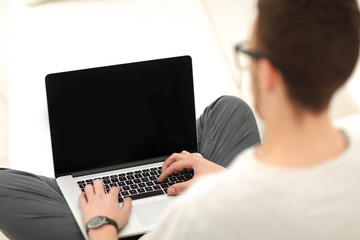 Fototapeta na wymiar closeup of a modern young man working on laptop