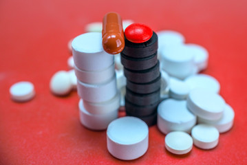 activated charcoal on the background of medicinal tablets