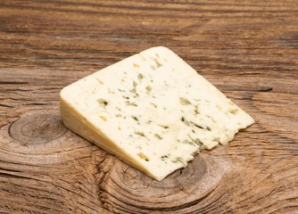  moldy blue cheese on wooden background