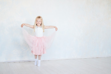 small happy girl dancer isolated.Cute little dancing, jumping,running child.  Children dance. Kids performing. Young gifted dancer in a class.Baby girl is studying ballet, modern dance.copy space