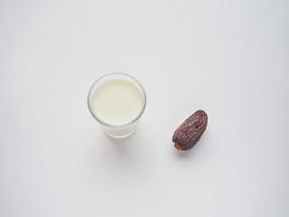 Sweet food for ramadan. Conceptual photo of Ramadan food:dates palm and milk.  
