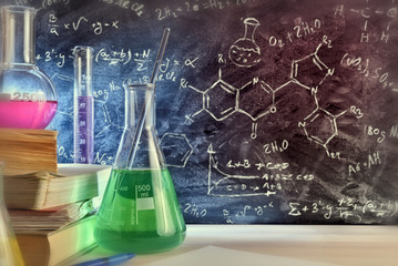 Classroom desk and drawn blackboard of chemistry teaching close up © Davizro Photography
