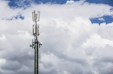 Communication pole on blue sky with cloud