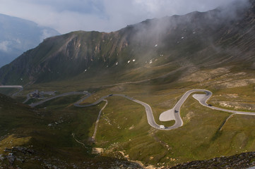 Serpentine road and beautiful clouds high in the mountains, Austrian Alps, national road Grossglockner