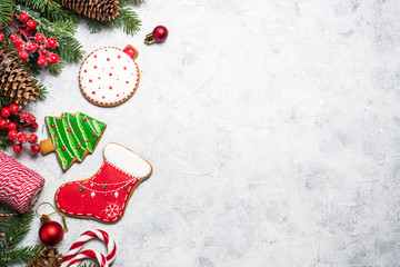 Christmas gingerbread and christmas decorations on gray stone table. Top view.