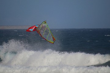 Windsurfer jumping a back loop