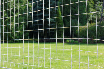 Obraz premium Volleyball net on a background of green grass. 