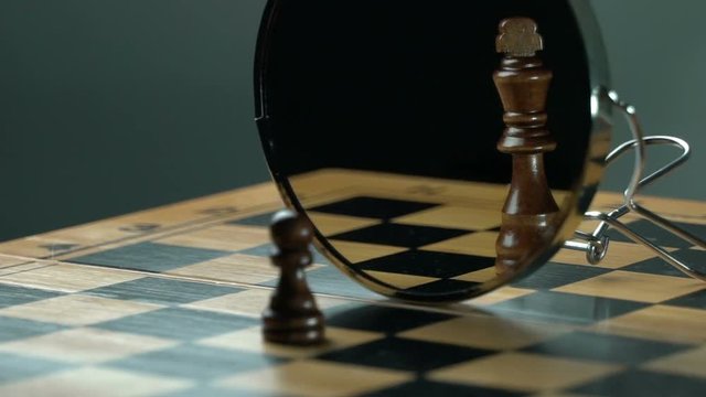 Balck pawn black king on the chess board