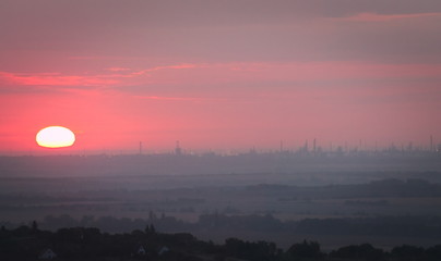 Sunrise over industrial horizont
