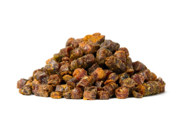Propolis granules isolated on white background, bee product