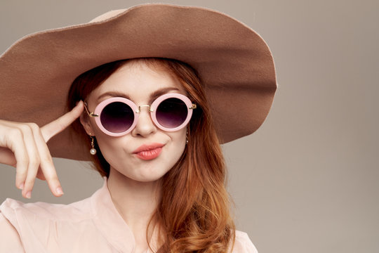 woman in glasses and hat portrait