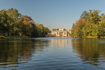 Fototapeta na wymiar Landscape of the Palace on the Isle in the Royal Baths Park on a sunny autumnal day, Warsaw, Poland