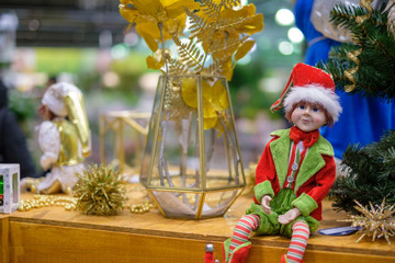 Christmas holidays wallpaper variety of decoration on sale. Dolls on shelves