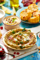 Avocado hummus sprinkled wth paprika powder an fresh parsley, delicious and healthy vegetarian dip