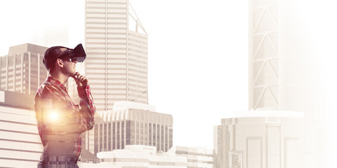 Guy wearing checked shirt and virtual mask holding hand on chin