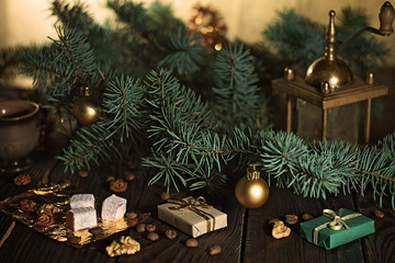 Fototapeta na wymiar Coffee grinder, coffee beans and Christmas tree branch on a wooden table