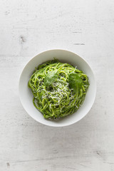 Spaghetti. Green spaghetti with spinach and parmesan. Italian and mediterranean cuisine