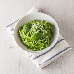 Spaghetti. Green spaghetti with spinach and parmesan. Italian and mediterranean cuisine
