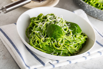 Spaghetti. Green spaghetti with spinach and parmesan. Italian and mediterranean cuisine