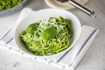 Spaghetti. Green spaghetti with spinach and parmesan. Italian and mediterranean cuisine