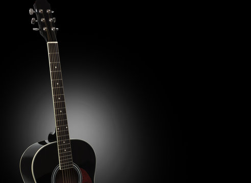 Acoustic guitar isolated on a black background