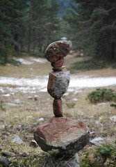 rock stacking in forest in winter, rocks in balance  