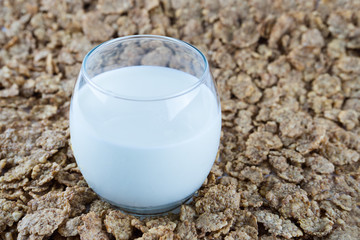 Breakfast in a glass of milk over muesli.