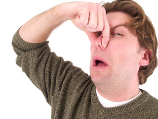 Man holding nose