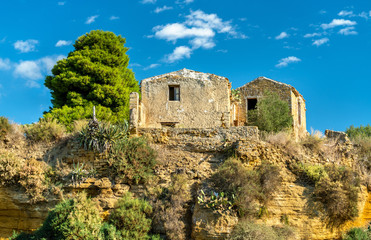 Fototapeta na wymiar Ancient houses in the gardens of the Valley of the Temples - Agrigento, Sicily
