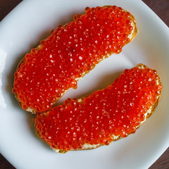 Bread with butter and caviar.
