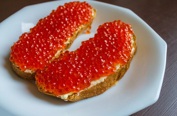 Bread with red caviar.