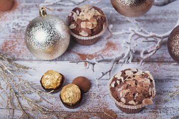 Tasty chocolate cupcake with sweets and winter decoration