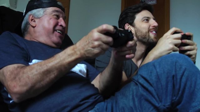 Father and Son Playing Videogame