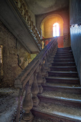Old vintage staircase in abandoned mansion
